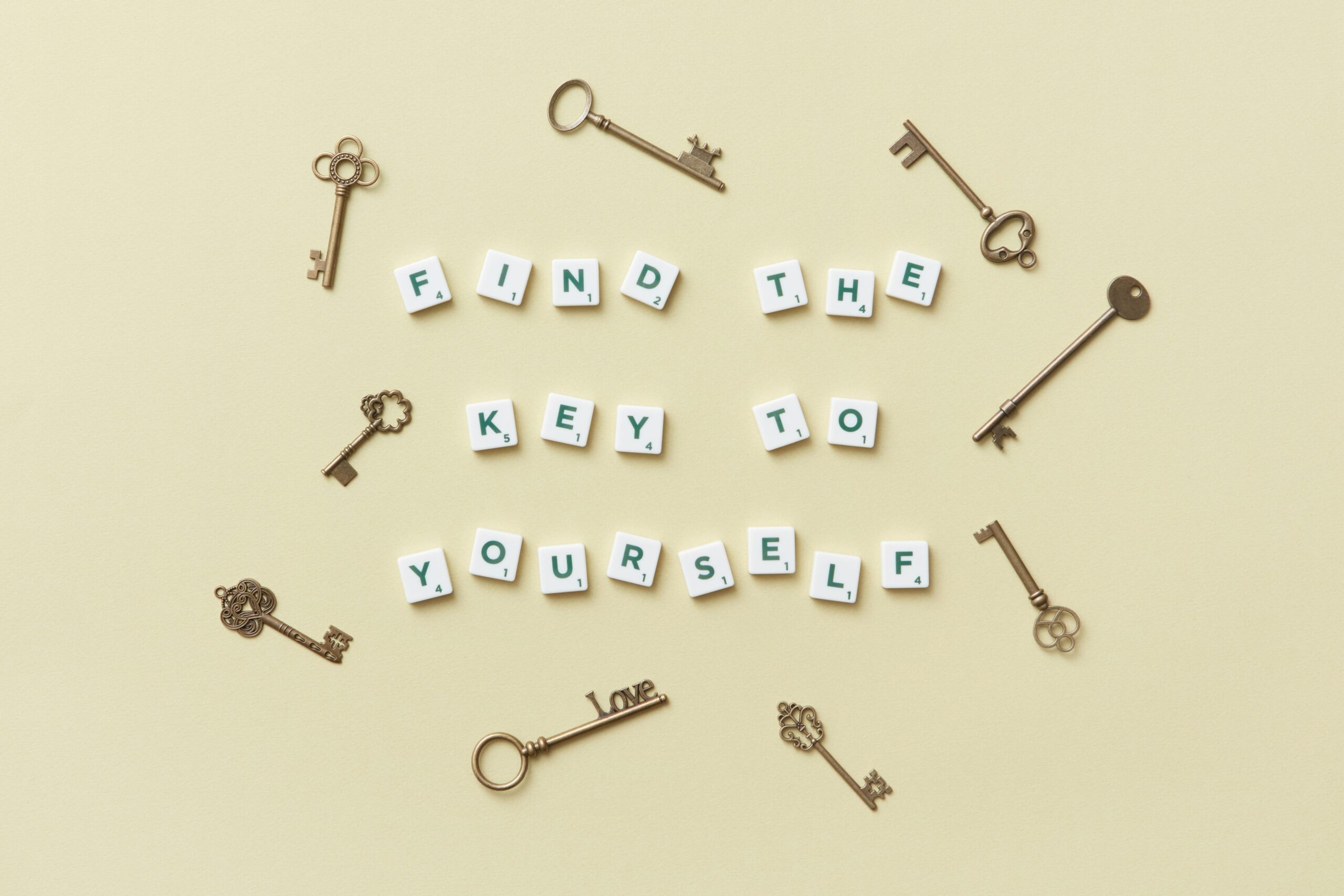 Image of keys and Scrabble blocks spelling “Find the key to yourself,” symbolizing awareness and breaking self-defeating behavior — from Dorice Horenstein’s message.