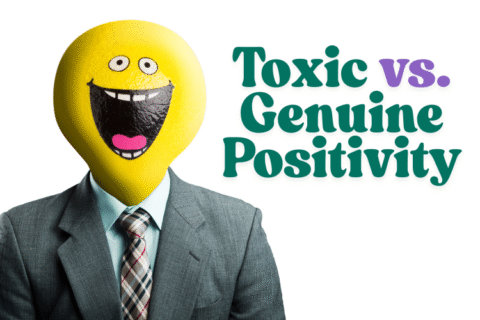 A contrast to genuine positivity — man in a business suit with a forced yellow smiley face mask, symbolizing inauthentic expression in the workplace.