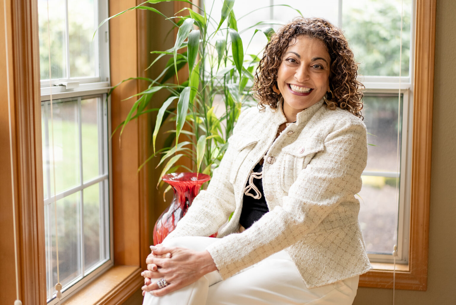 Dorice Horenstein, author, smiling and wearing white.