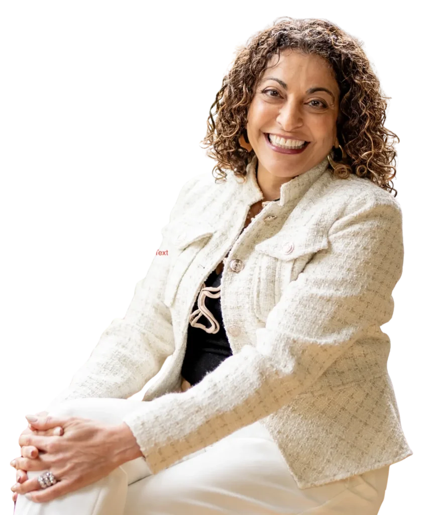 Dorice Horenstein, keynote speaker and leadership coach, smiling by a window.