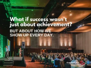 Dorice Horenstein delivering a leadership keynote speech to a packed conference hall with motivational text overlay about daily success for the blog building a culture of excellence